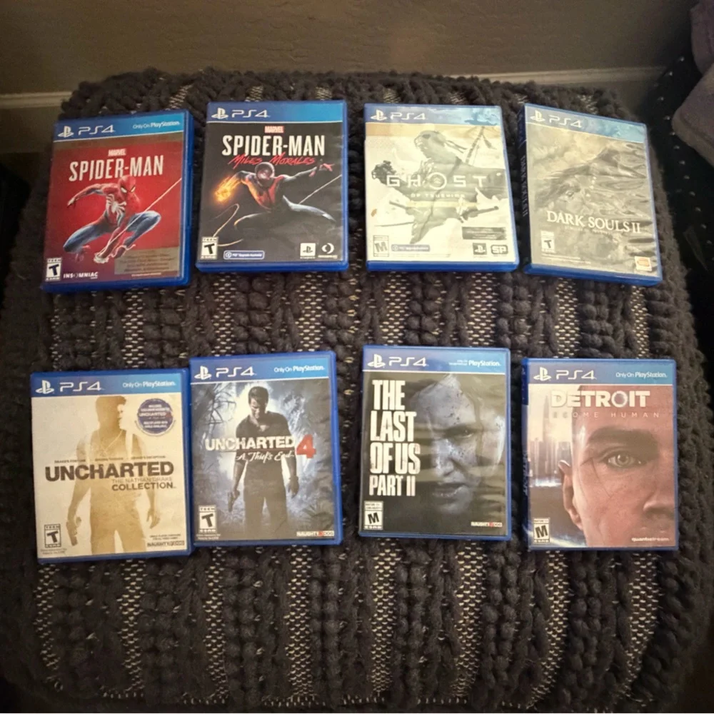 Sony PlayStation 4 with 2 Controllers and 8 Games